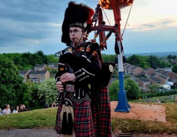 Bagpipe Player at the Beacon Lighting 2 June 2022 at Chapel on the Hill